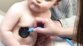 Adorable Baby Boy Cuddles on Nurse