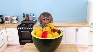 Monkey Baby Bon Bon bathes with duckling in the bathtub and eats yellow watermelon in the kitchen