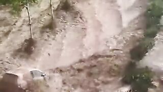 Dramatic moment severe flooding sweeps cars away in Spain.