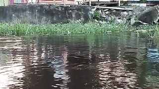 Fishing near the house using a boat