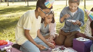 Children are celebrating birthday with cake