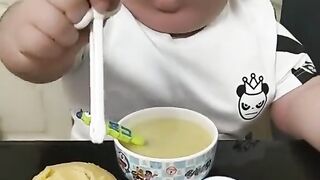 Cute funny boy eating food