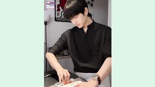 Handsome chinese boy cooking