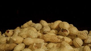 Pile of peanuts on a black background