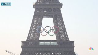 Olympic rings installed on Eiffel Tower to mark 50 days to start of the Paris Games.