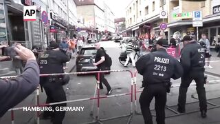 Police shoot man allegedly threatening them with axe in German city hosting Euro 2024 match.