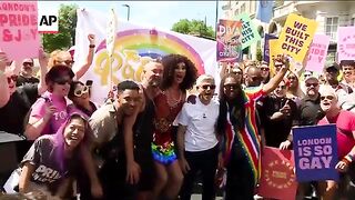 Sun shines on tens of thousands of revellers joining annual Pride parade in central London