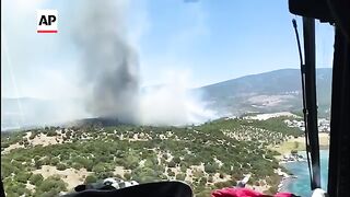 Firefighter helicopters and planes deployed to contain wildfires in western Turkey