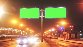 Green screen billboard with a green screen on a street