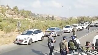 Hard-right Israeli minister Itamar Ben-Gvir inspects the scene of the shooting operation near the town of Idhna.