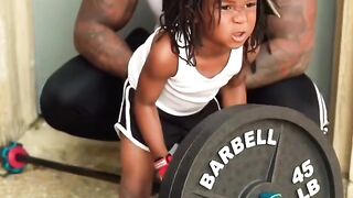 Hard workout for child: Back exercise.