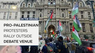 Pro-Palestinian protesters rally outside debate venue