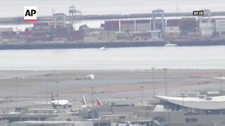 Small plane lands safely at Boston airport with just one wheel deployed.