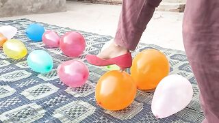 Ballon busting with high heel