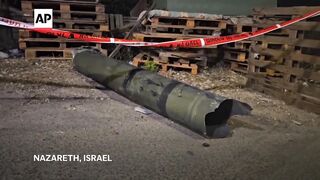 Part of an intercepted rocket launched from Lebanon falls in Nazareth.