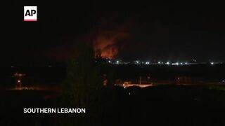 Explosions light up night sky in southern Lebanon.