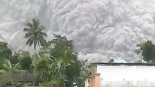 natural disaster the volcano erupted thick smoke covering the entire city