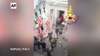 Building collapses near Naples, killing 2 children and trapping 2 women.