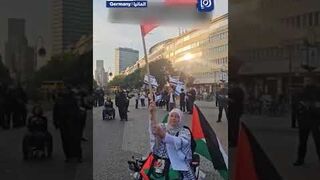 Elderly woman shows support for Palestine in Germany