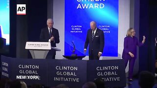 Bill Clinton awards Joe Biden the 2024 Clinton Global Citizen Award.