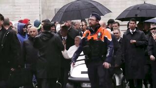 Pope Francis greets the crowd in Belgian town Leuven .