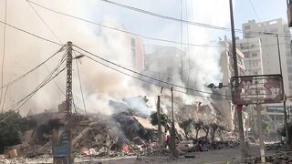 Smouldering rubble after Israeli strike on south Beirut suburbs _ AFP.