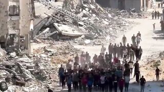 Funeral of martyrs amidst rubble and ashes