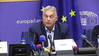 Protester interrupts Viktor Orban's speech at the European Parliament .