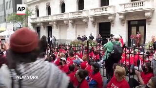 Pro-Palestinian protesters arrested outside New York Stock Exchange.