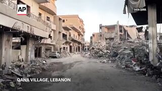 Mass destruction in Lebanon's Qana town after Israeli air strikes.