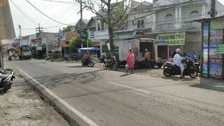 Transport of wood passing through the city streets of Medan, North Sumatra