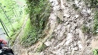 Riding a motorbike on a slippery and ravine road