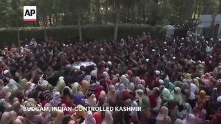 Funeral held for 7 killed while working on tunnel project in Indian-controlled Kashmir.