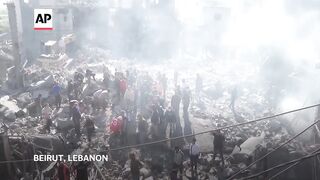 Rescuers search for survivors in Beirut after buildings destroyed by airstrikes.