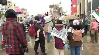 People rally in solidarity with Palestinians in front of CBC Manitoba building