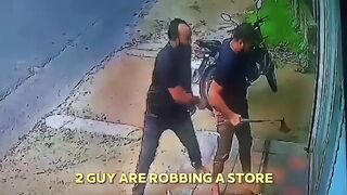 2 guy are robbing astore