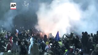 Georgian protesters clash with police for a second night after EU talks are suspended