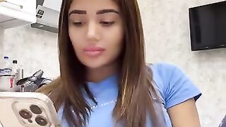 Beautiful girl relaxing in the kitchen while live streaming