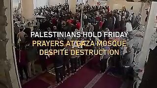 Palestinians hold Friday prayers at Al-Farouq Mosque in Gaza despite its bombing