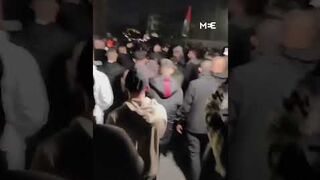 Jenin residents carry fighters from the Jenin Battalion during demonstration