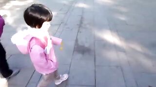 Little Girl Playing With Animal