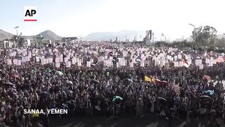 Yemen residents burn Israel and US flags in protest against Gaza attacks.