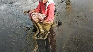 Enjoying muddy shoreline activities at Onar Baru Village, Teluk Bintuni, West Papua.