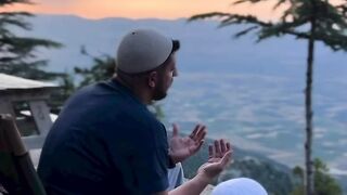 Father teaches son to pray