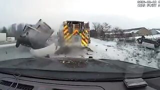 Truck crashes into emergency vehicles on an icy interstate in Michigan