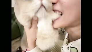 girl shows her anger on cat