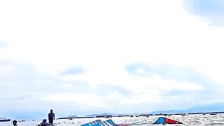 Vibrant Scene of People Enjoying a Day in Calm Coastal Waters