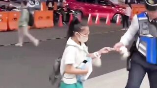 schoolgirl confronts an armed security