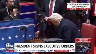 President Trump signs executive orders before supporters