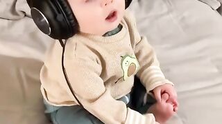 Baby is enjoying with headsets